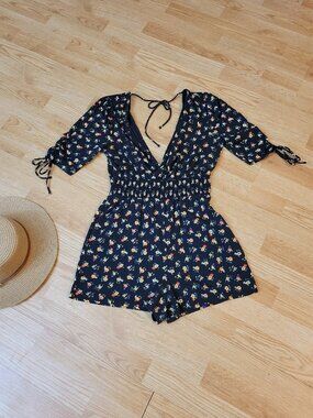 Adorable black ditzy floral romper/playsuit by Top Shop. Size 6. Or small.
